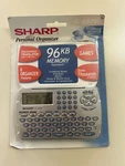 Sharp EL-6920B Personal Organizer Games Translator Calculator Schedule Open Box. Fixed Price $14.95.