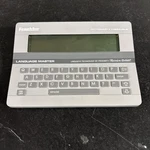 Franklin Computer Language Master Electronic Dictionary Thesaurus LM-2000. Fixed Price $16.00.
