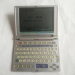 Sharp Papyrus PW-A8100 Electronic Dictionary Tested Working Used With Cover. Fixed Price $50.00.