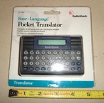 New Sealed Vintage Radio Shack 63-2166 Four Language Pocket Translator. Fixed Price $19.99.